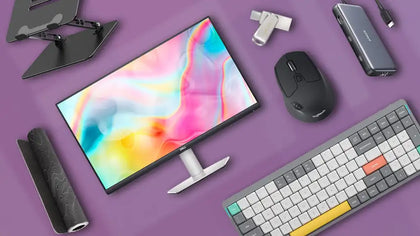 Computer accessories on a purple background: monitor, keyboard, mouse, stand, and gadgets.