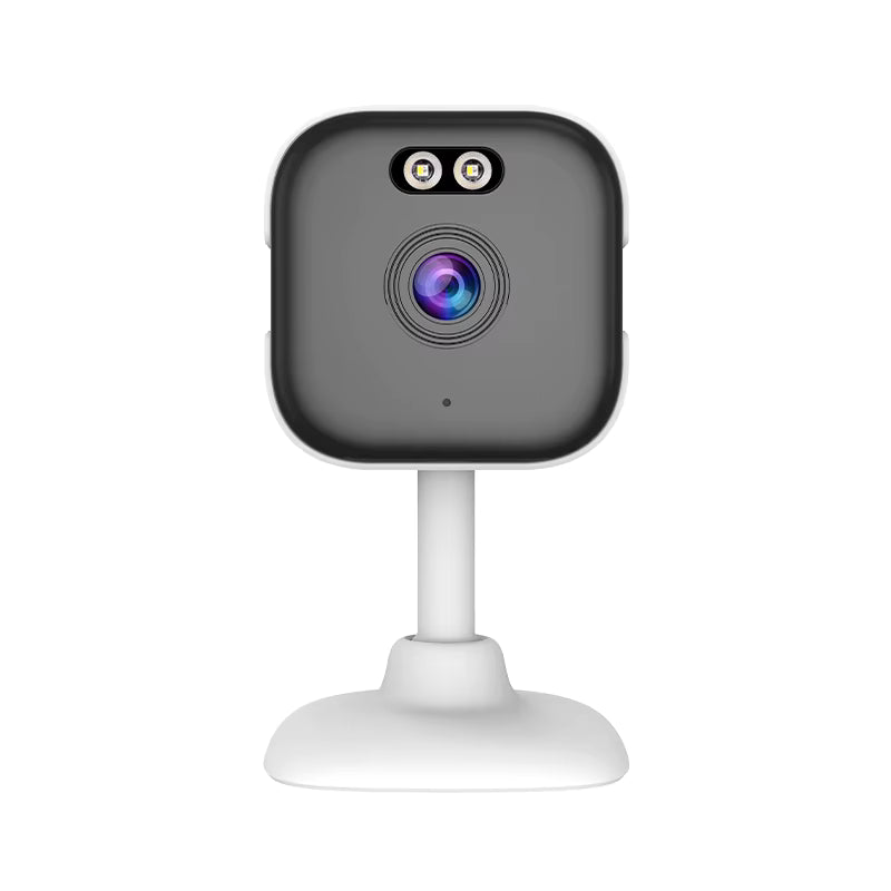 Compact black and white security camera with dual lenses and a stand.