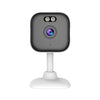 Compact black and white security camera with dual lenses and a stand.