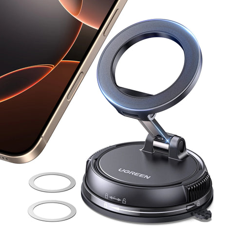 Phone holder with LED ring light on a black base, gold phone edge, and two metal rings nearby.
