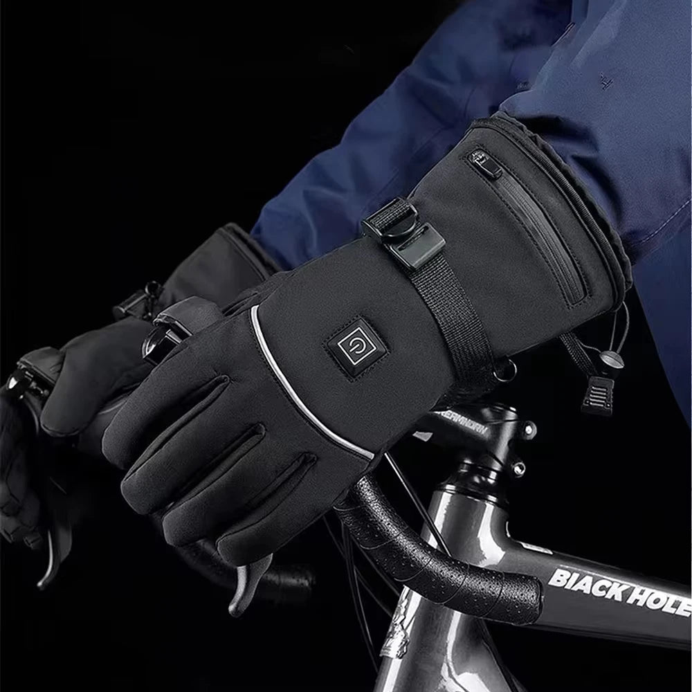 Hands in black gloves on a bicycle handlebar, with a navy blue jacket against a dark background.