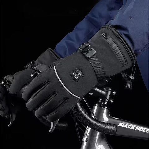 Hands in black gloves on a bicycle handlebar, with a navy blue jacket against a dark background.