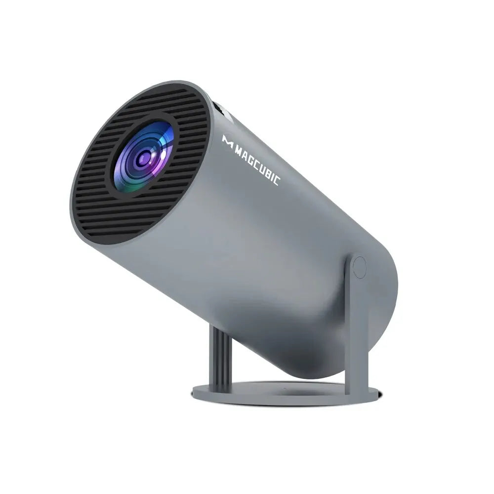 Sleek gray projector with black grill and colorful lens, mounted on a circular base.