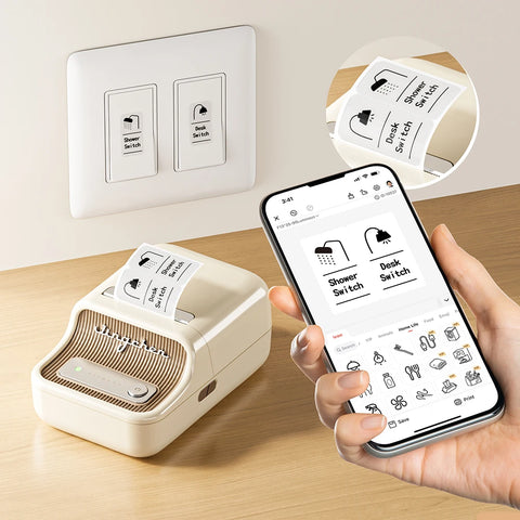 Smart label printer with phone app, creating labels for switches on a beige surface.