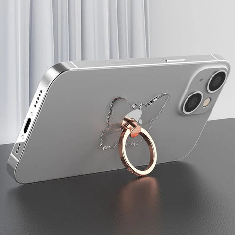 Silver smartphone with butterfly-shaped ring holder, dual cameras, and sleek design.