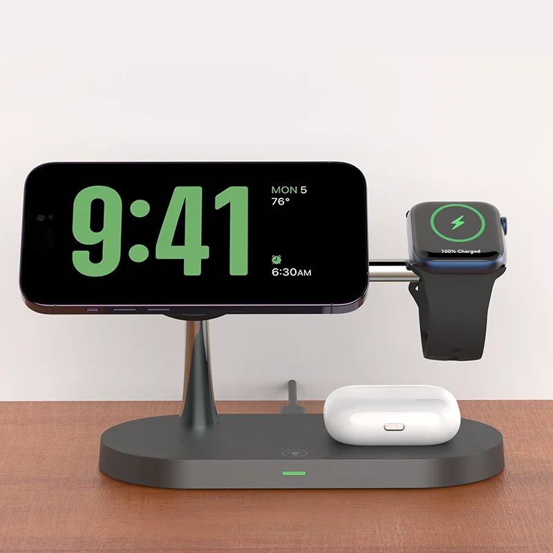 Smartphone, watch, and earbuds charging on a sleek black stand, green digital clock display.